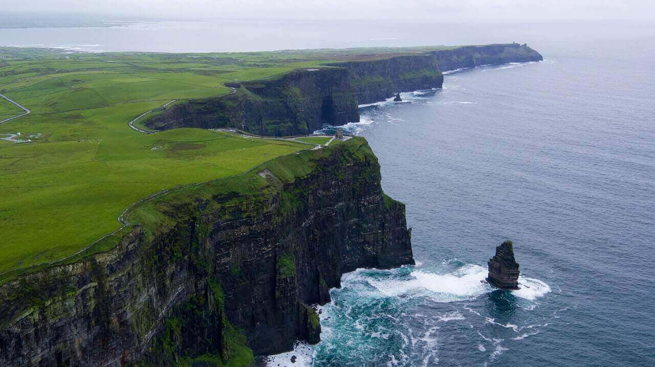 beautiful green shores on the water with cliffs